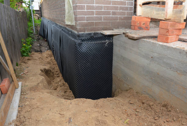 Happy homeowners after waterproofing job in Carteret